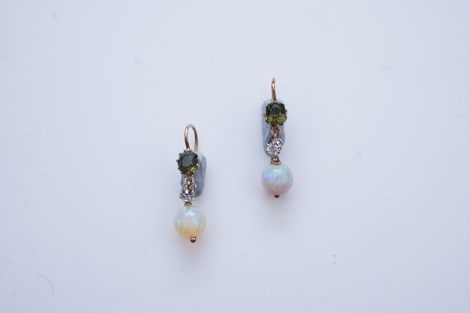 A pair of opal, green zircon and diamond earrings